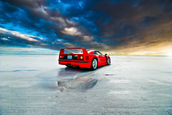 Картинка автомобили ferrari берег облака красный