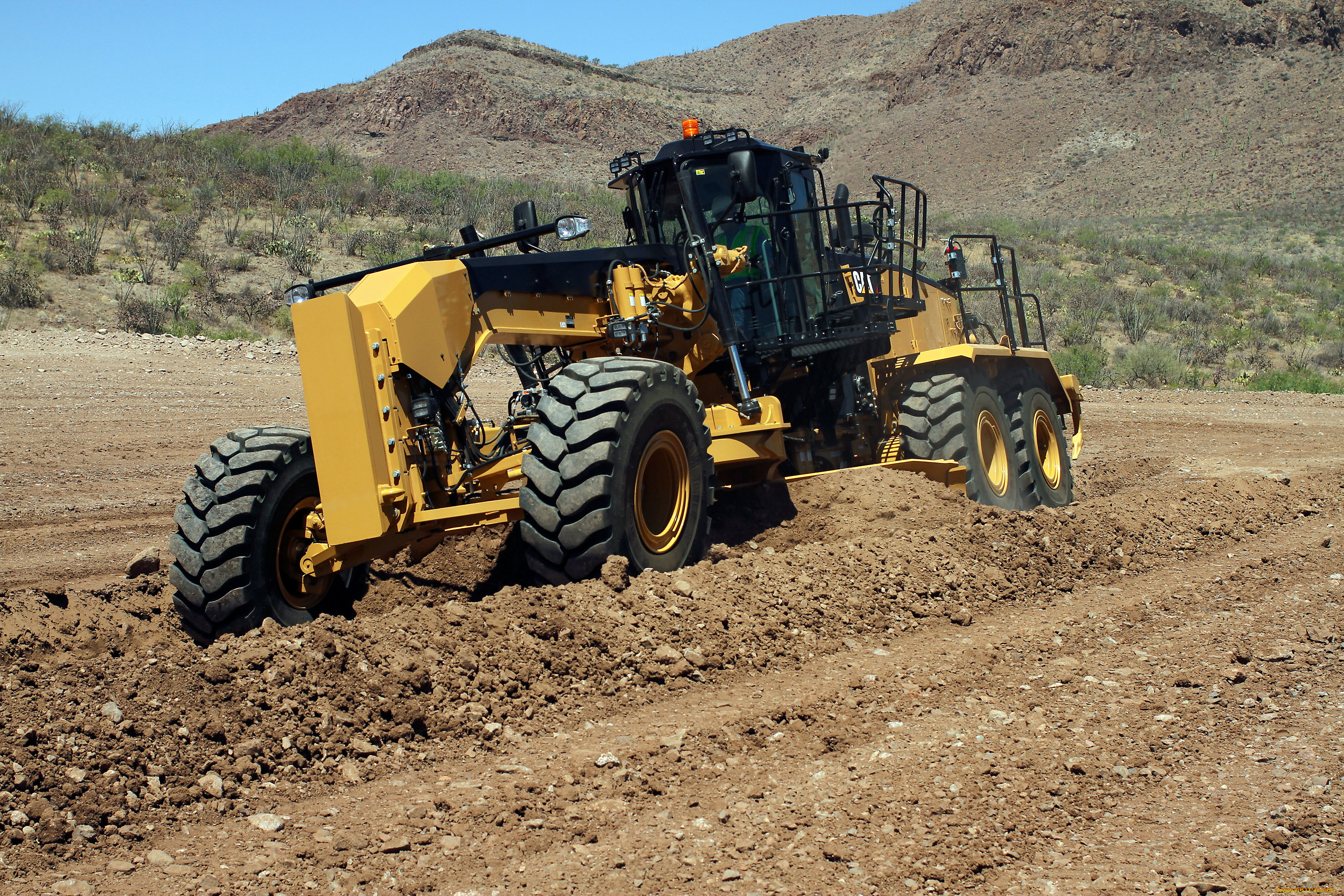 Грейдер фото. Автогрейдер Caterpillar 16m. Грейдер Cat 16m. Грейдер кат м 16. Автогрейдер Cat 16.